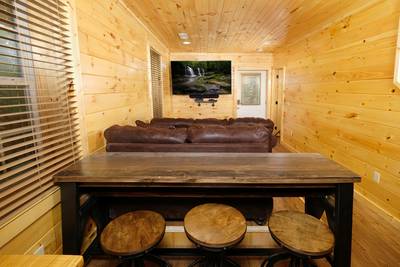 Timber Tree Lodge theater room and bar area with stools