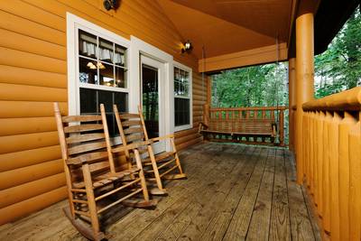 Timber Tree Lodge covered back deck with swing