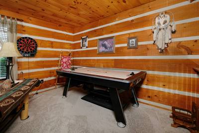 Mountain Magic upper level loft area with air hockey table and dart board
