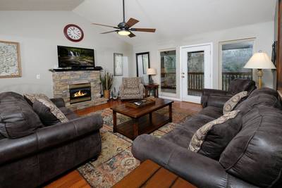 Whispering River living room with gas log fireplace
