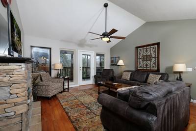 Whispering River living room with leather furniture