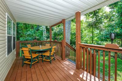 Lee's Creekside back deck with table and chairs