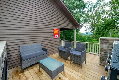 The Road Less Traveled front deck with outdoor furniture