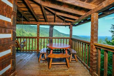 Old Glory covered deck with table chairs