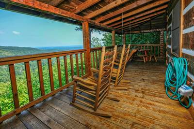 Old Glory wrap around deck with rocking chairs