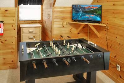 Fuzzy Bear upper level bedroom 2 with foosball table