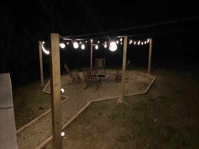 Dreams Come True fire pit area at night