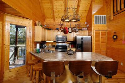 River Livin fully furnished kitchen with stainless steel appliances