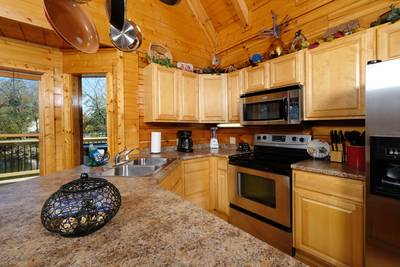 River Livin fully furnished kitchen with bar countertop