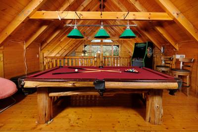 River Livin upper level loft game room with pool table