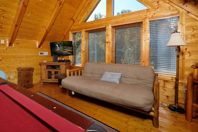 River Livin upper level loft game room with futon