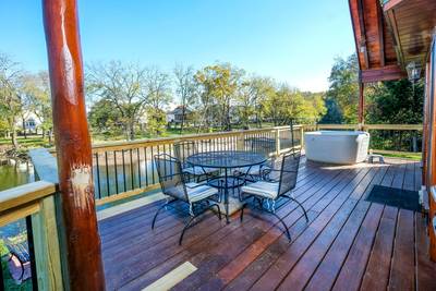 River Livin main level back deck with table and chairs