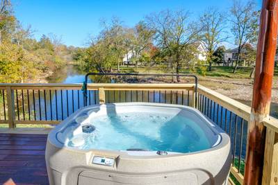 River Livin main level back deck with hot tub