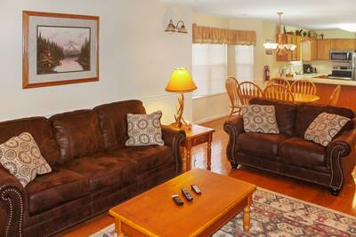 Grand River Canyon living room with fully furnished kitchen