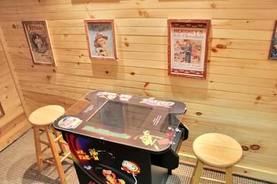 Creekside Lodge lower level multipurpose room with cocktail style arcade game