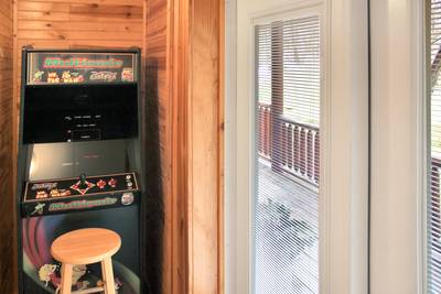Creekside Lodge lower level multipurpose room with stand up arcade game