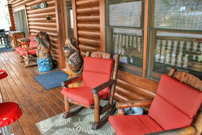 Creekside Lodge main level covered deck with rocking chairs