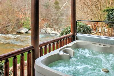 Creekside Lodge lower level covered deck with hot tub