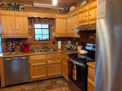 Mountain Magic fully furnished kitchen with stainless steel appliances