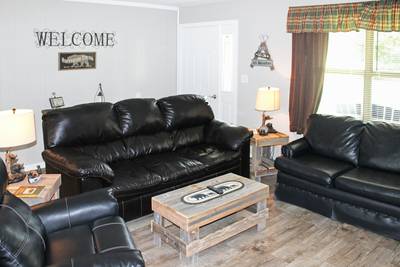 Rustic Acres living room with leather furniture