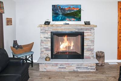 Rustic Acres living room with seasonal gas fireplace