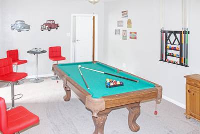 Rustic Acres game room with pool table