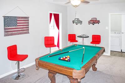 Rustic Acres game room with pool table