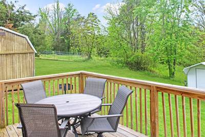 Rustic Acres back deck with table and chairs