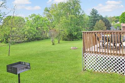 Rustic Acres back yard with charcoal grill