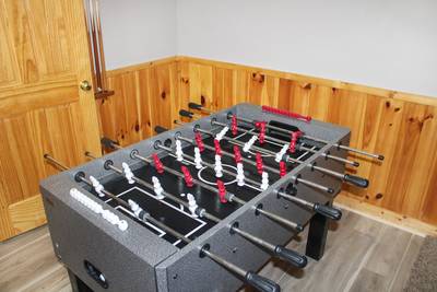 Striking Waters foosball table in lower level game room