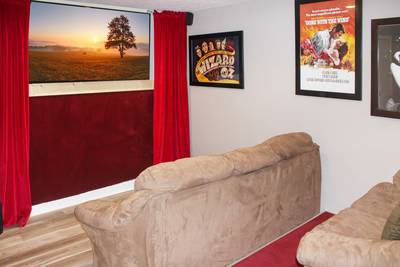 Striking Waters Lower Level Theater Room with 70-inch Flat Screen TV