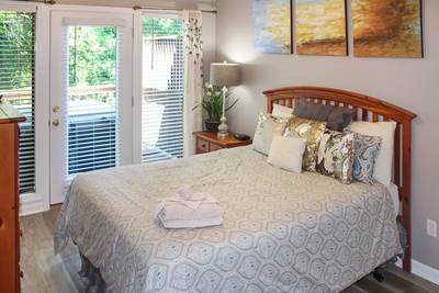 Striking Waters main level bedroom two with queen size bed