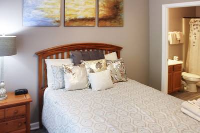 Striking Waters main level bedroom two with queen size bed