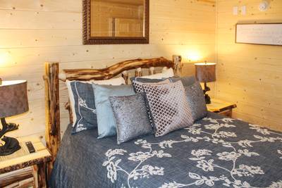 Striking Waters lower level bedroom three with queen size bed