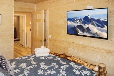 Striking Waters lower level bedroom three with 50-inch flat screen TV