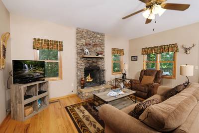 Lone Pine Lodge living room with wood burning fireplace