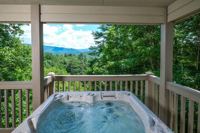 Lone Pine Lodge covered back deck with hot tub