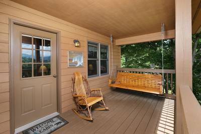 Bearfootin covered back deck with swing