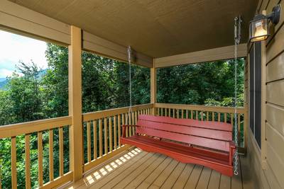 Nestled Inn covered back deck swing