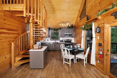 My Pigeon Forge Cabin spiral staircase and fully furnished kitchen
