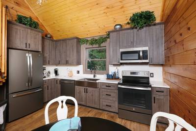 My Pigeon Forge Cabin fully furnished kitchen with granite countertops and stainless steel appliances