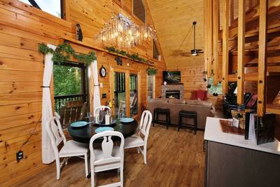 My Pigeon Forge Cabin dining room and living room
