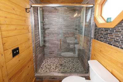My Pigeon Forge Cabin main level bathroom 1 walk-in Spa shower