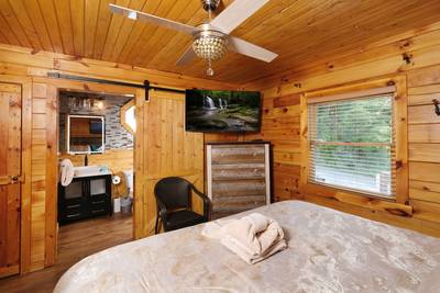 My Pigeon Forge Cabin main level bathroom 2 with 50-inch flat screen TV
