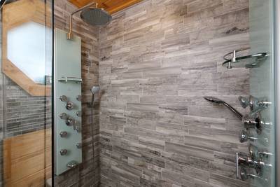 My Pigeon Forge Cabin main level bathroom 2 walk-in spa shower