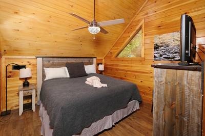 My Pigeon Forge Cabin upper level bedroom 3 with king bed