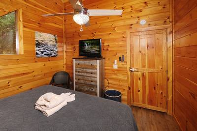 My Pigeon Forge Cabin upper level bedroom 3 with 50-inch TV