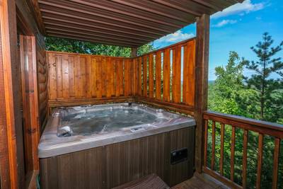 Angels View lower level covered back deck with hot tub