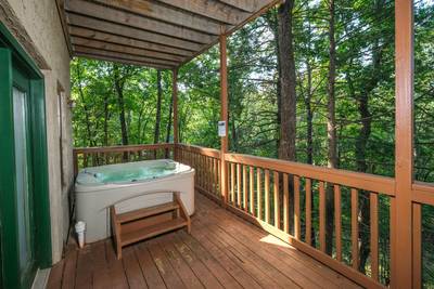 Grandpas Getaway lower level covered deck with hot tub