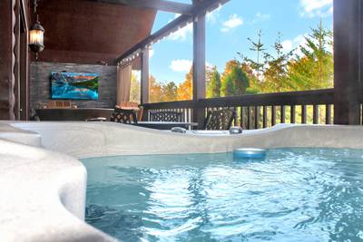 My Pigeon Forge Cabin view from hot tub on main level covered back deck